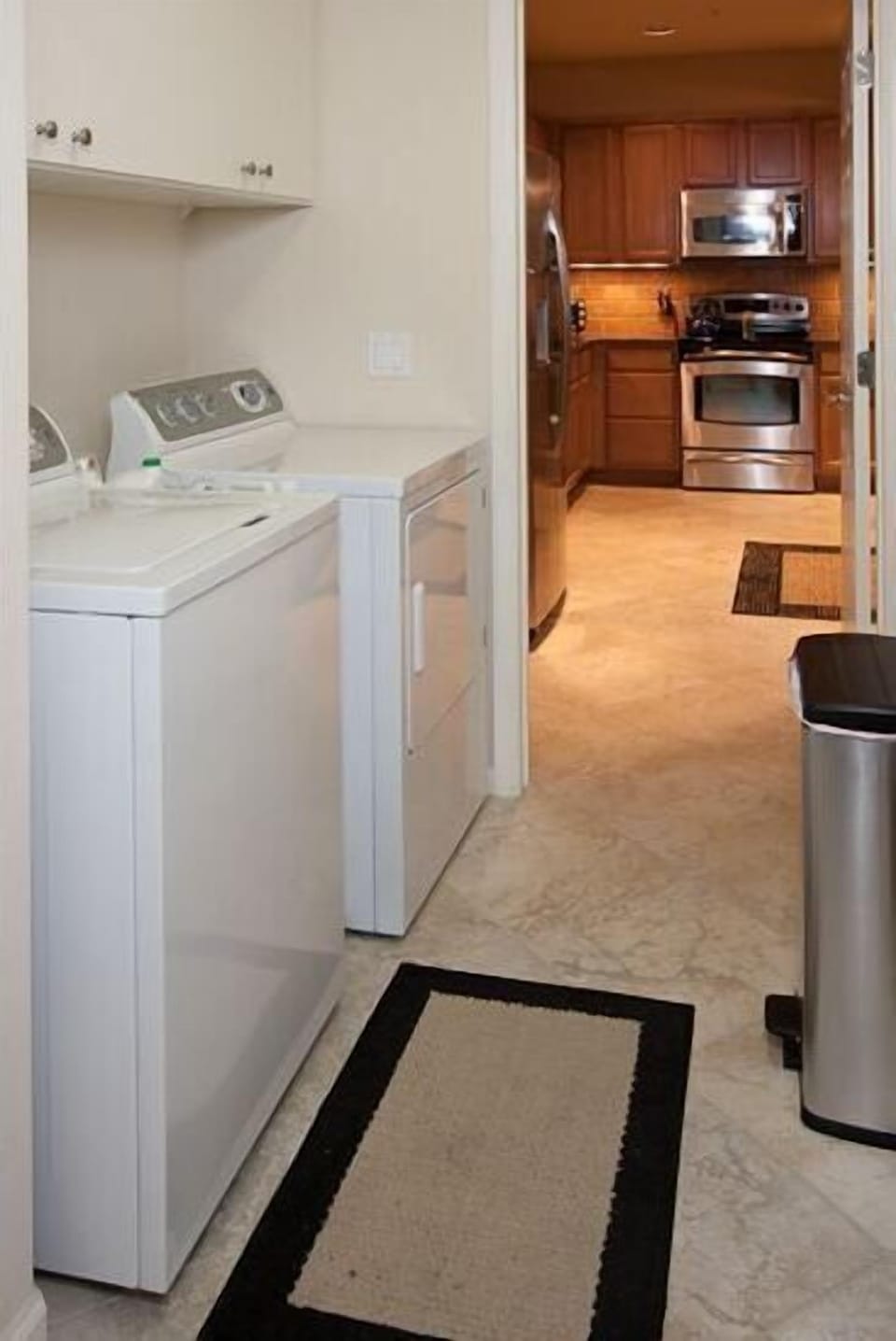 The view as you enter from the garage through the laundry room into the kitchen.