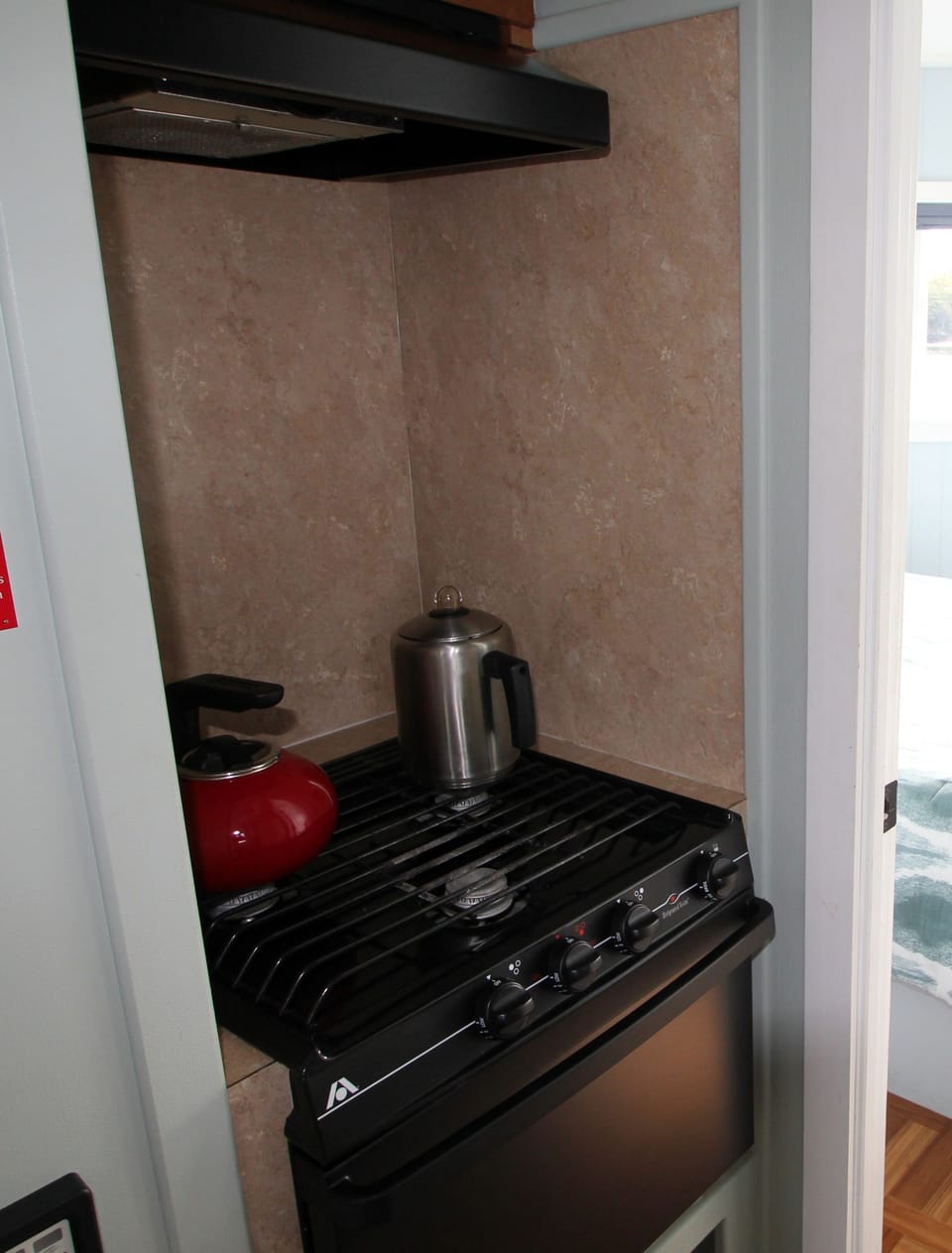 propane stove with oven.  Perc type coffee pot.