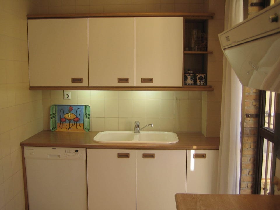 Separate kitchen with dishwasher