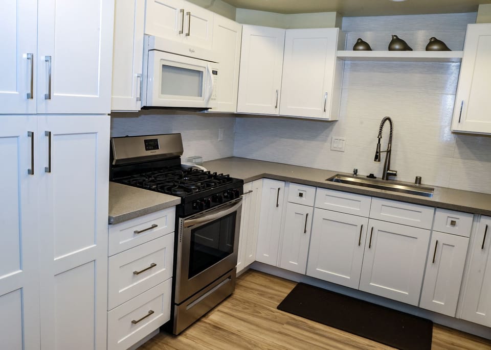 View of range and Quartz countertops 