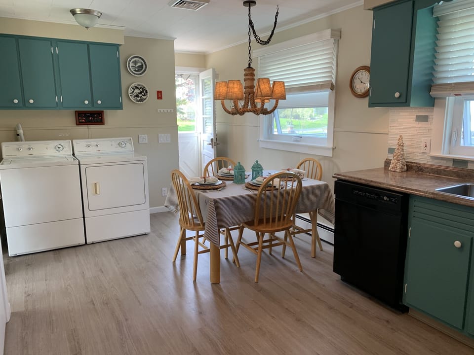 Kitchen with new flooring throughout the house, Washer and dryer