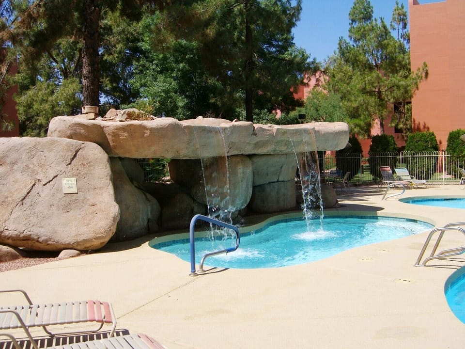 Beautiful waterfall jacuzzi.  This is one of 5 pools with jacuzzi