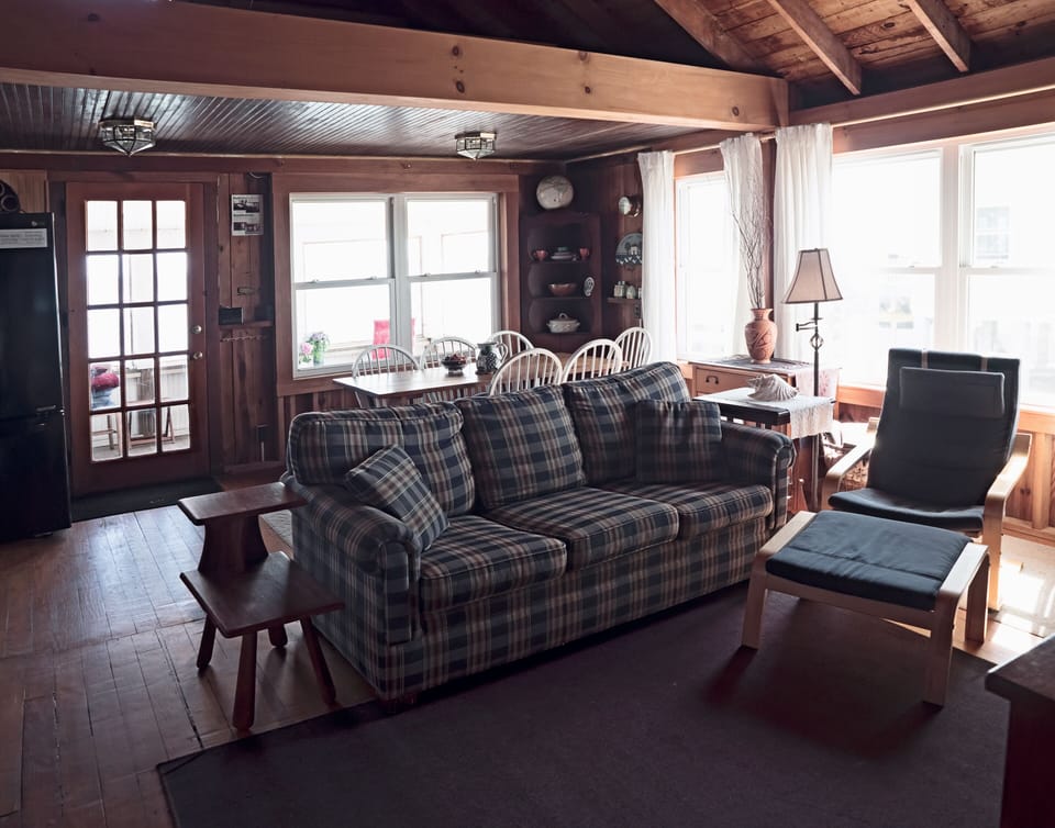 Interior: living room/dining area. Bright, airy, and comfortably furnished.