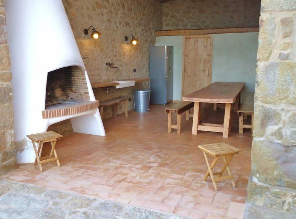 Prepare and enjoy your meals here by the BBQ and dining table