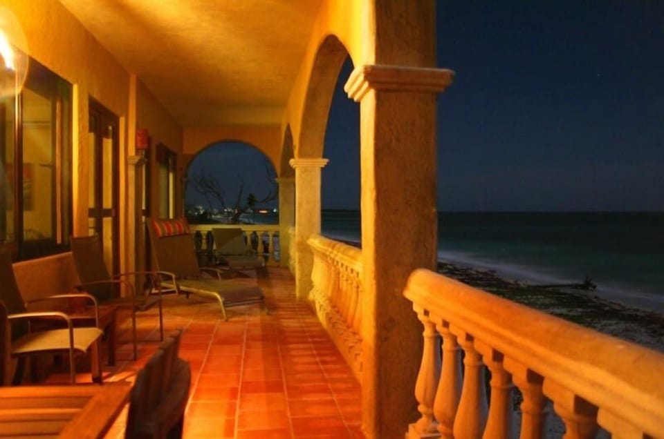 The front terrace at night. Enjoy cocktails, breezes, and the sound of the waves