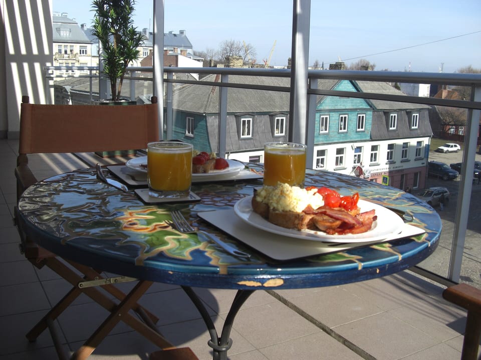 Eat breakfast on the terrace looking over the beautiful old town of Liepaja