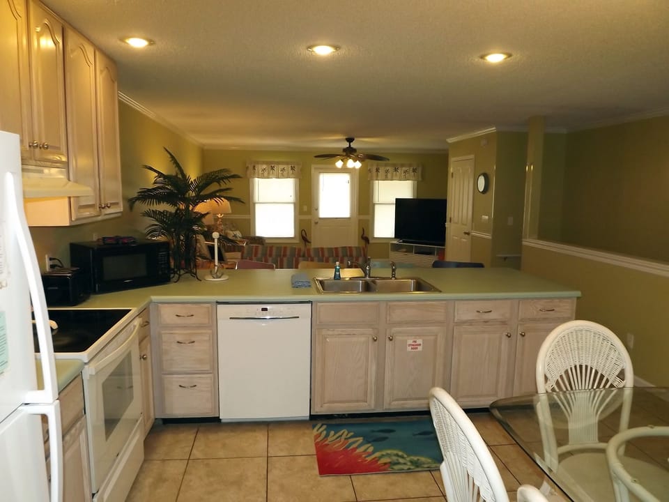 Kitchen peninsula and view of the living area