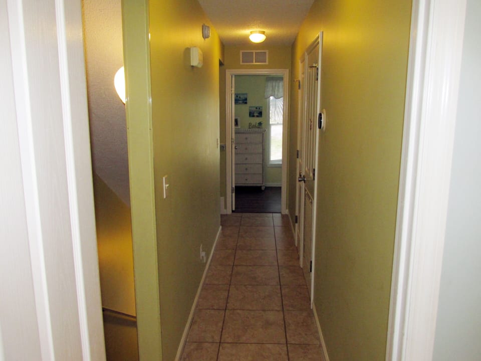 Upstairs hallway looking from the primary bedroom to the secondary bedroom