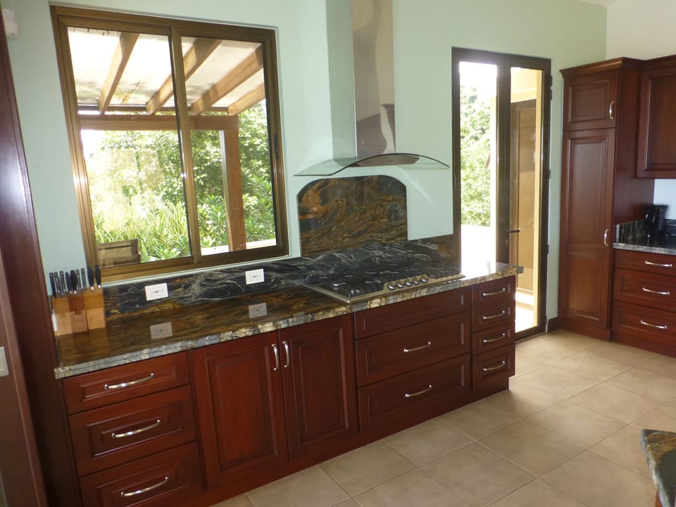 The kitchen is bright, well-equipped, and has an up-scale gas stovetop. 
