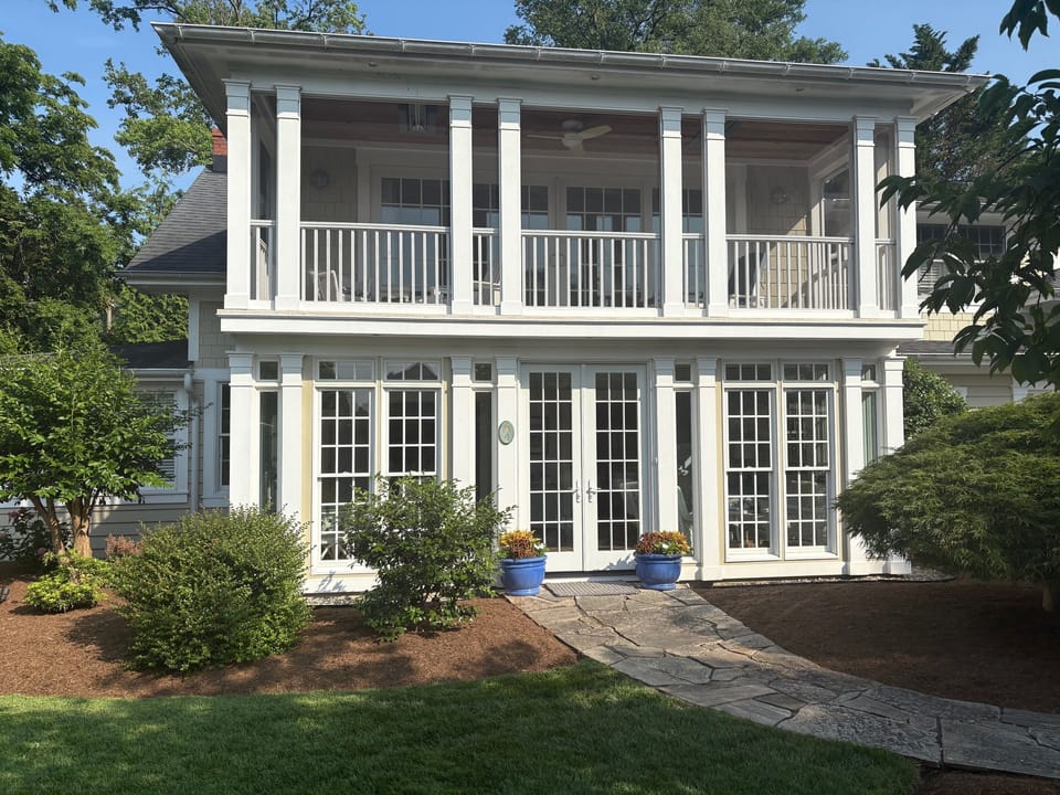 Front of the House - Sunroom below and Screen Porch above.