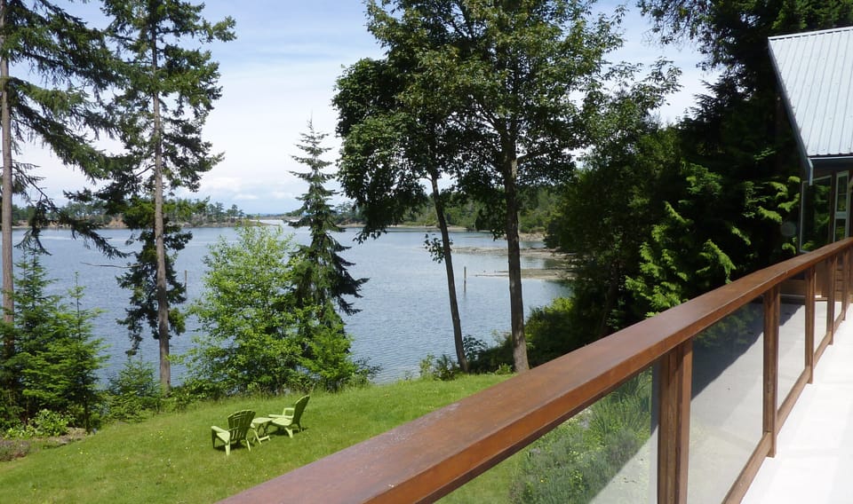 View of lawn, Winter Cove, Boat Pass and the mainland in the distance beyond BP