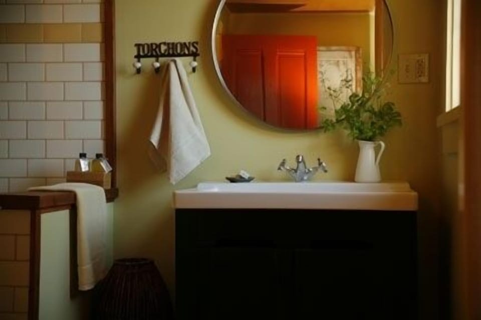 Upstairs bathroom with shower and custom made, herbal soap and shampoo