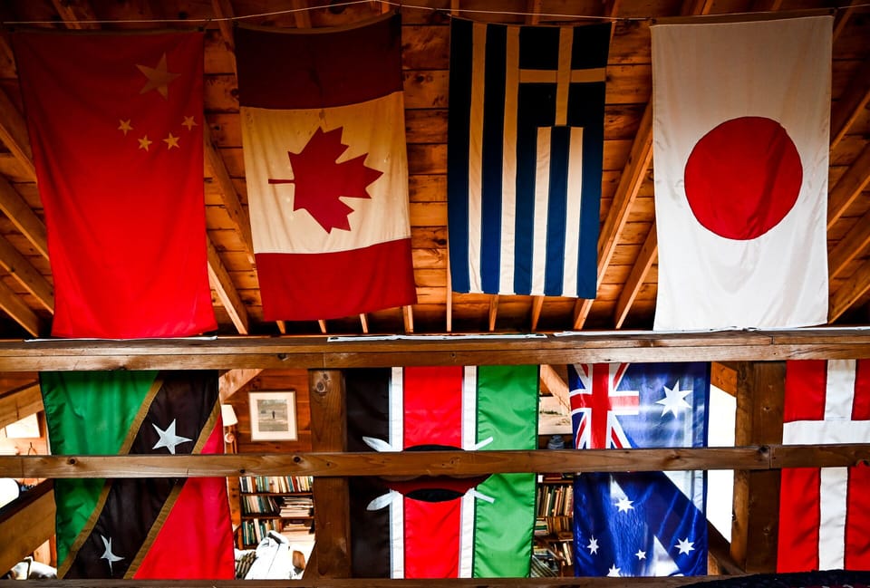 A festive flag collection fills the vaulted ceiling, as seen from the Loft.  