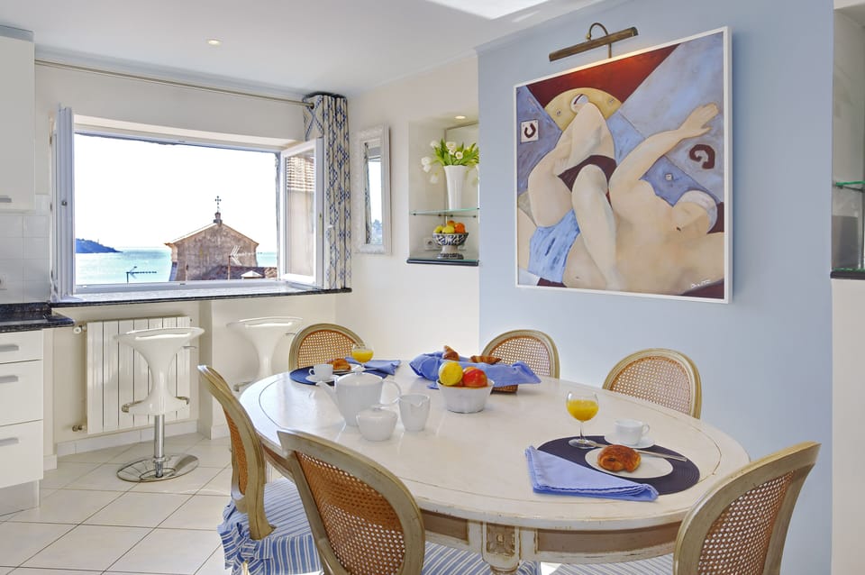 Dining room with Water Polo painting
