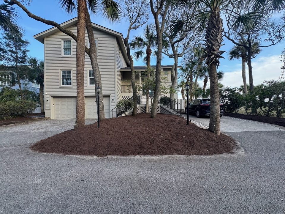 Front of home - parking for up to six vehicles (two drives and garage)