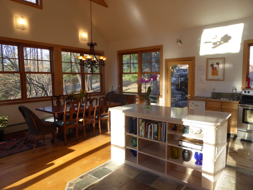 kitchen and island adjacent to dining table