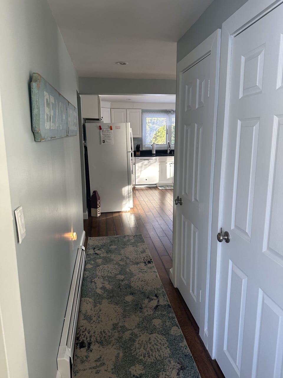Hallway connecting family room to kitchen