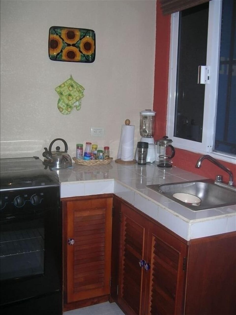 Kitchen with full size fridge & gas stove.