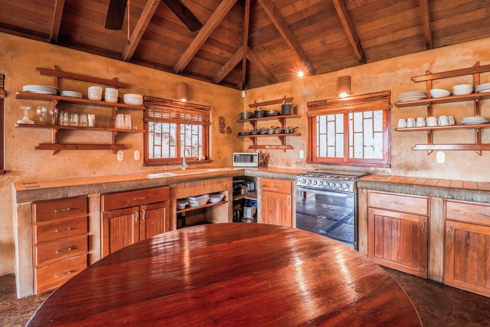 Fully stocked kitchen with modern appliances including a gas oven/stove.