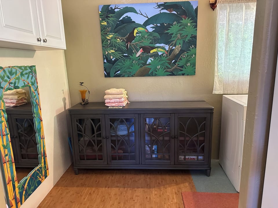 Laundry room is conveniently located by the kitchen, beach towels ready for swim