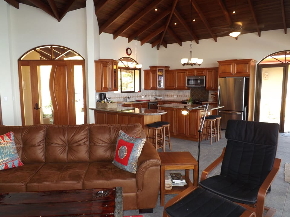 Rich wood~tasteful decor~tons  of windows/doors/light = all the comforts of home