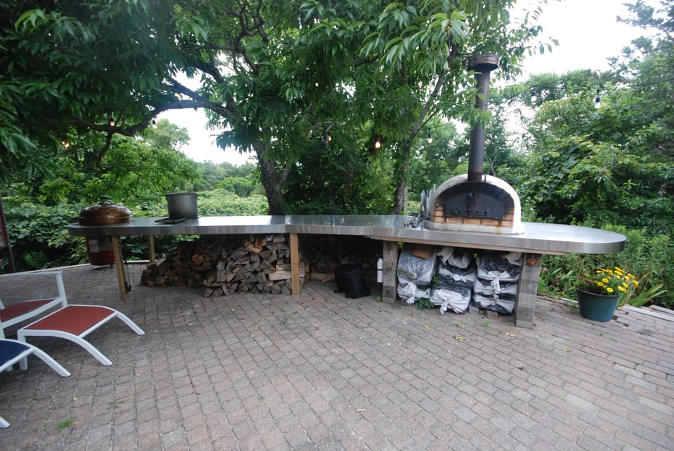 New! Stainless steel counter with pizza oven, integrated charcoal grill & burner