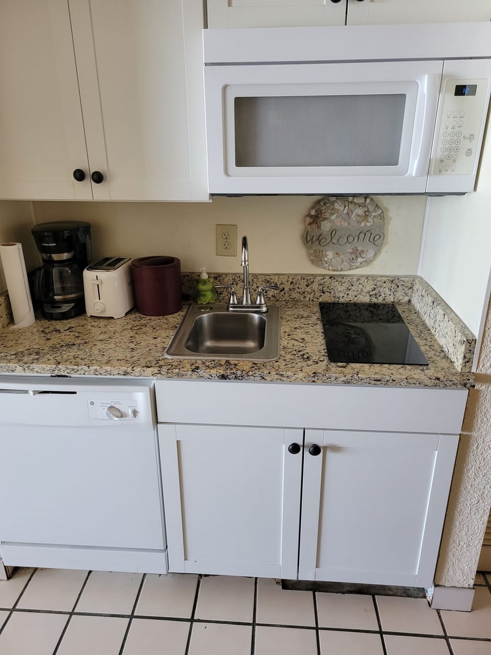 remodeled kitchen cabinets, glass cooktop, and granite countertop! 