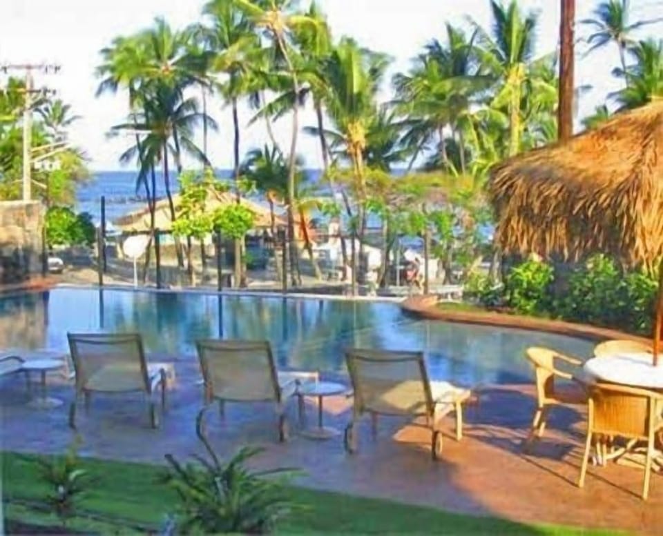 Our beautiful infinity pooloverlooking the beach,has lounge chairs,barbq,tables