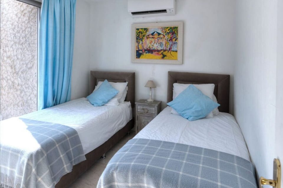 Twin balcony bedroom