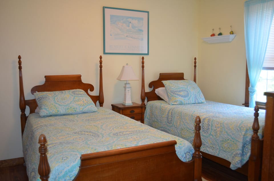 First floor bedroom with two twin beds.