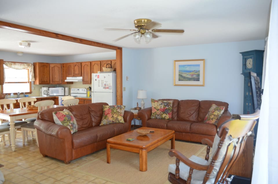Airy living room with ceiling fan.