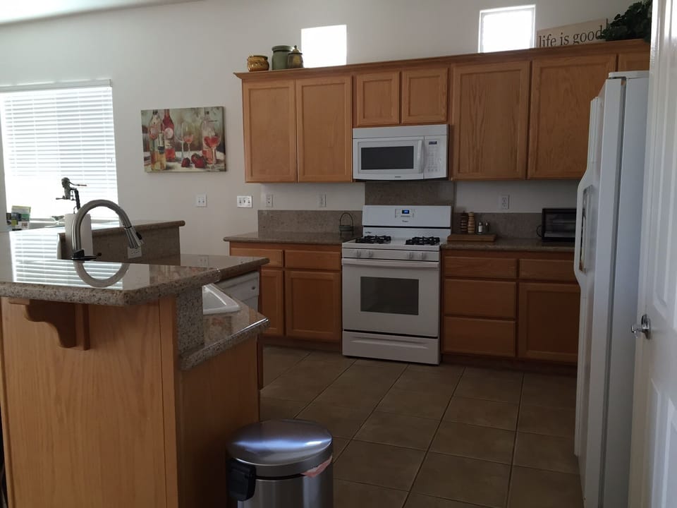 Kitchen with granite countertops. 