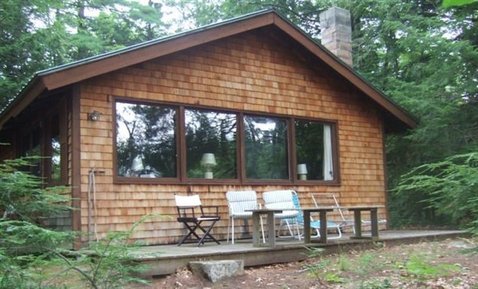 Main house with wrap-around deck, facing east.