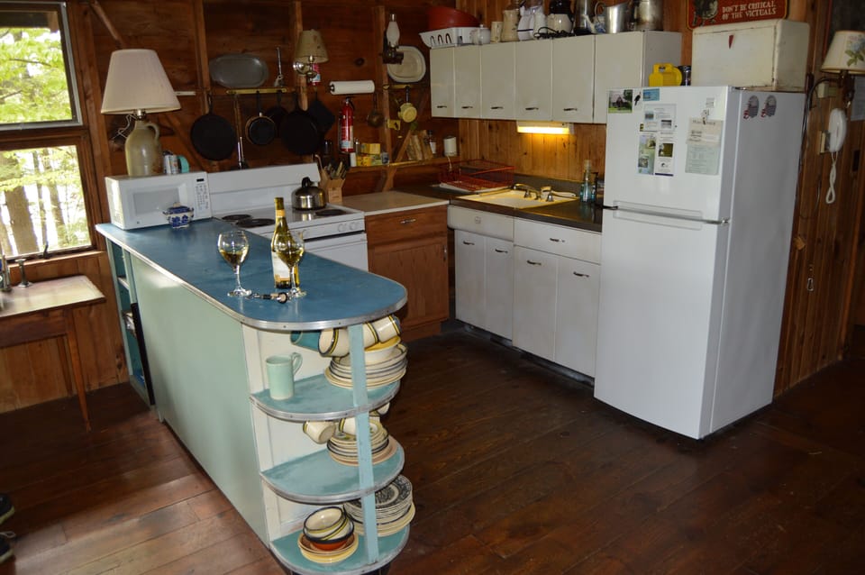 Kitchen. Cabinets  straight out of the 1950s. New fridge, elec. stove, microwave