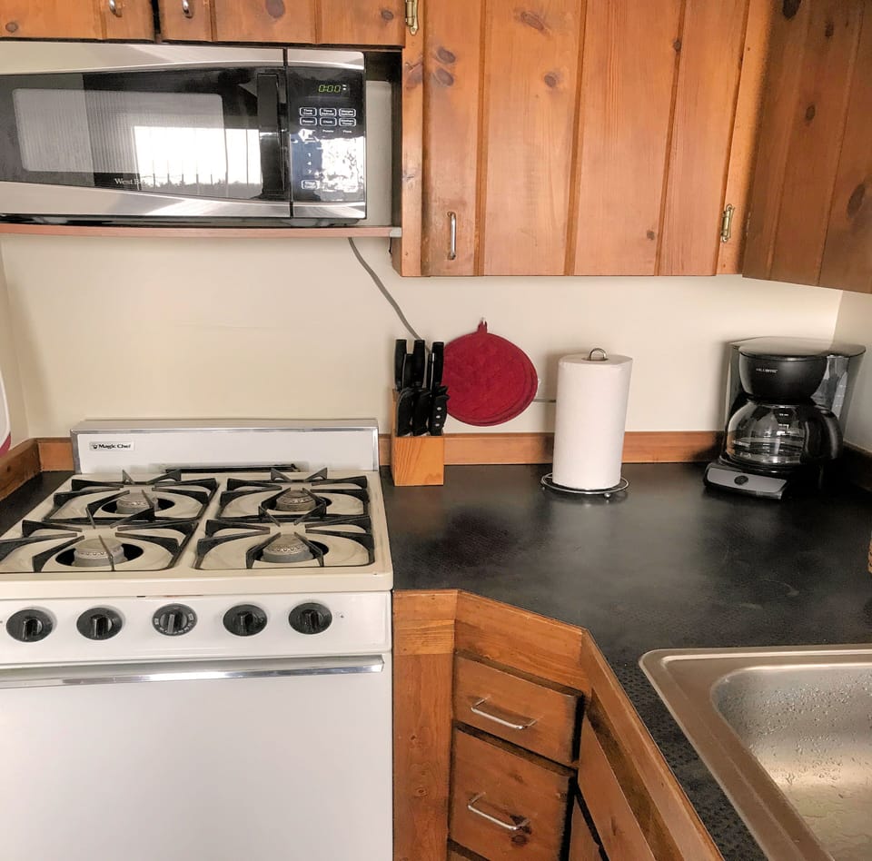 Full Range with Oven, Microwave, and Coffee Maker.