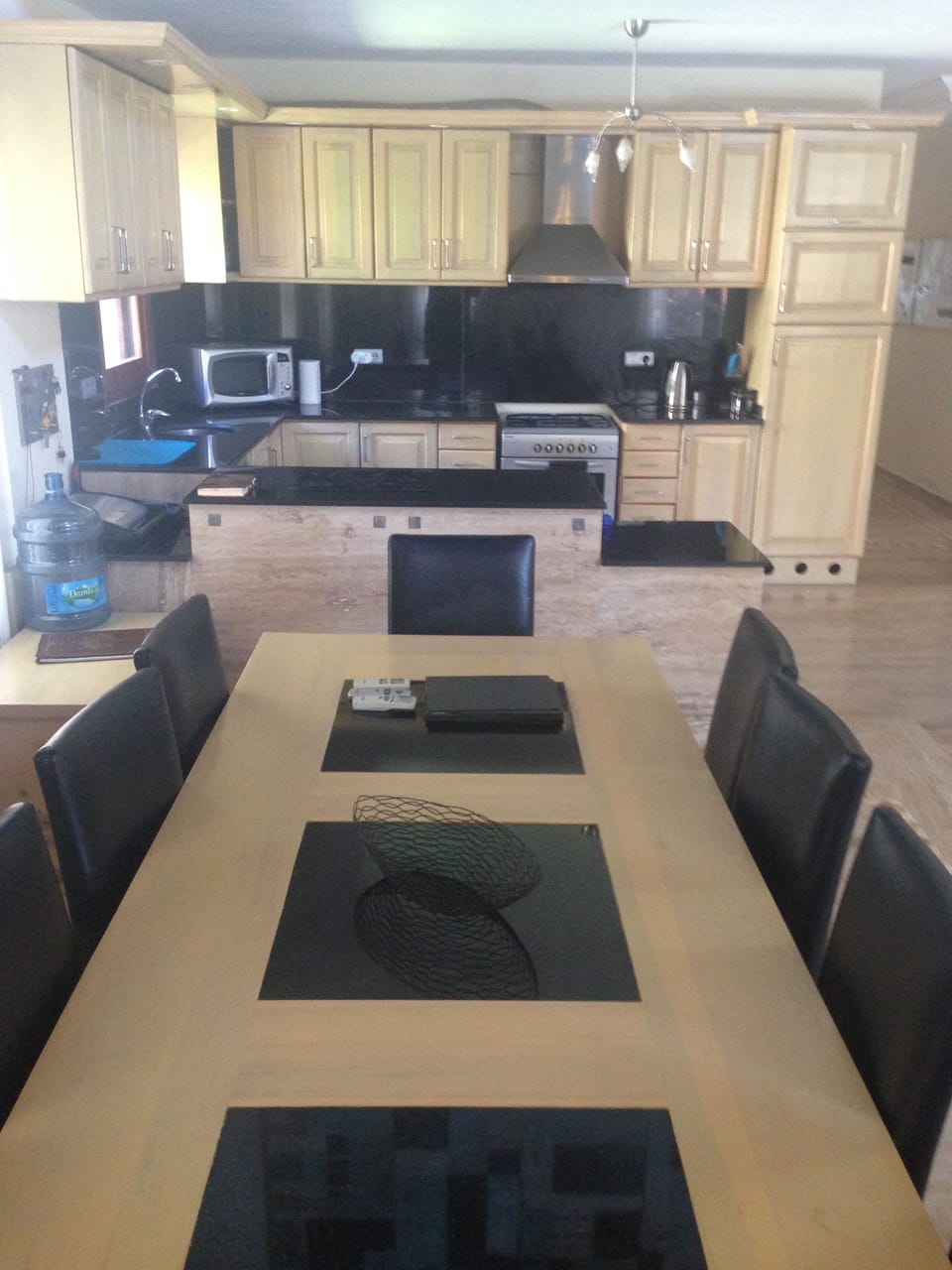 Huge inside dining table seats 10 inlaid granite next to kitchen