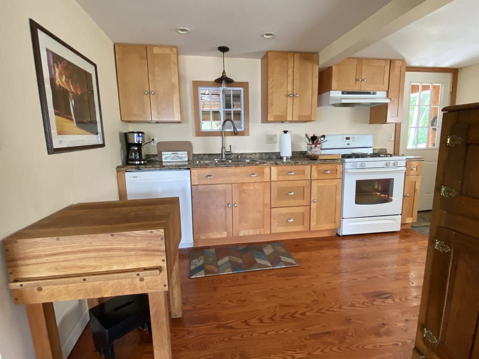 Well-stocked kitchen:  plates,  silverware, frying pans, cups, glasses etc.
