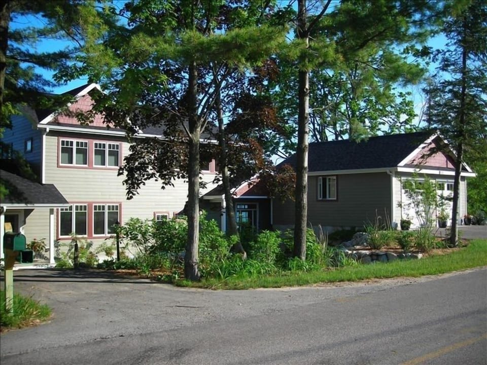 View of the cottage (home) from quiet and rural S Stony Point Rd, Suttons Bay