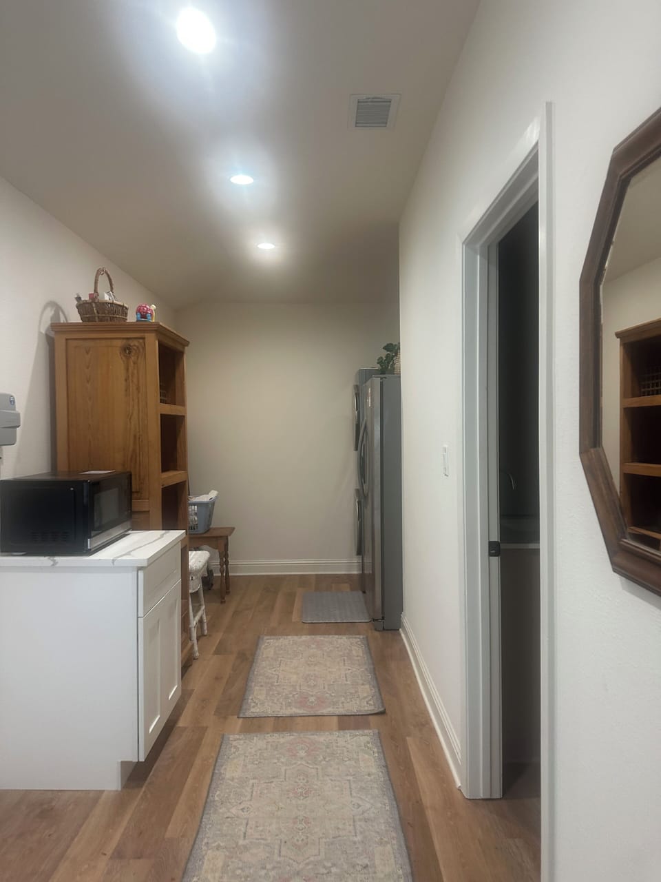 Mud/laundry room with extra microwave and refrigerator and freezer 