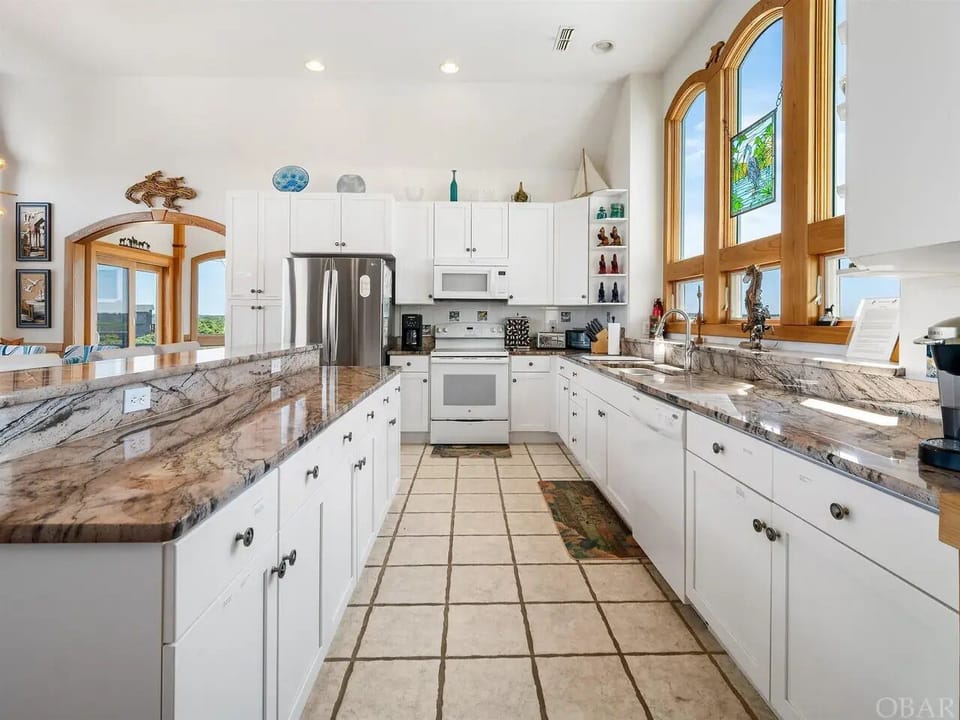 Large kitchen area with lots of counterspace.
