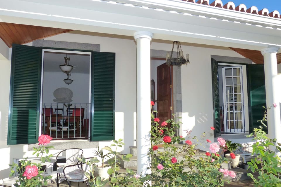 External covered terraces  with rosegarden.