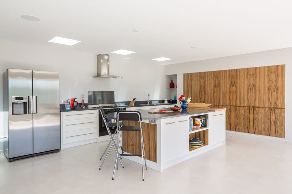 Kitchen with 3 huge double doors out to terrace over-looking view