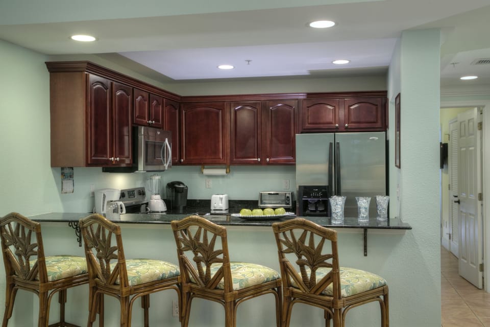 Seating for four at counter; fully furnished kitchen with granite counter tops.