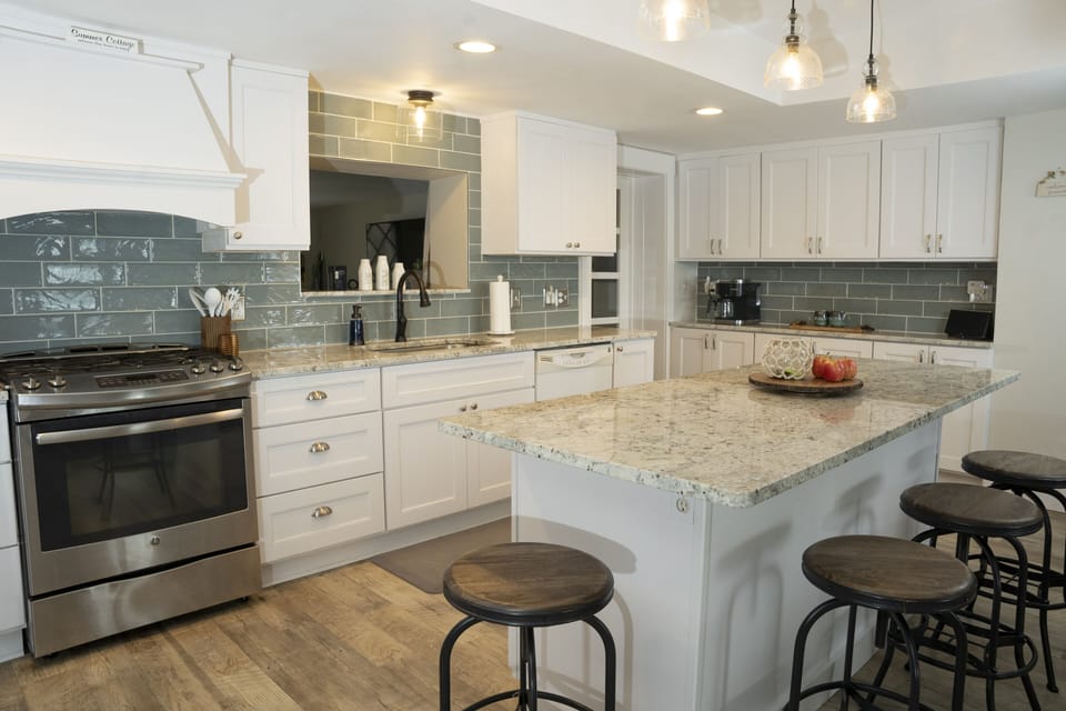 Large chef's kitchen with island seating.