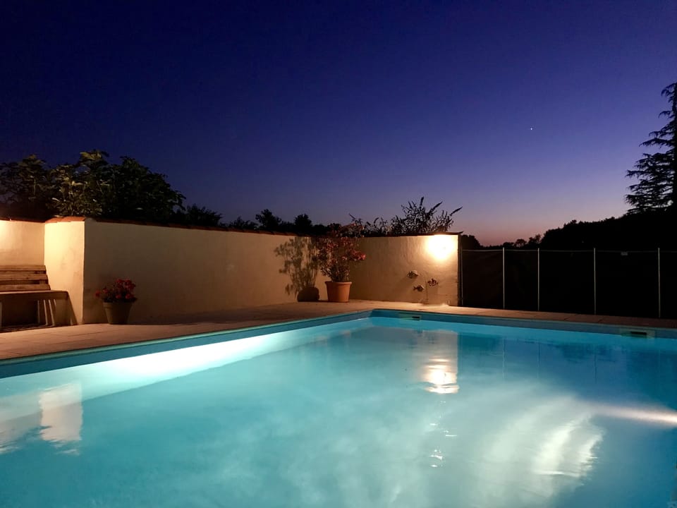 Take a midnight dip under a peaceful starry sky 
