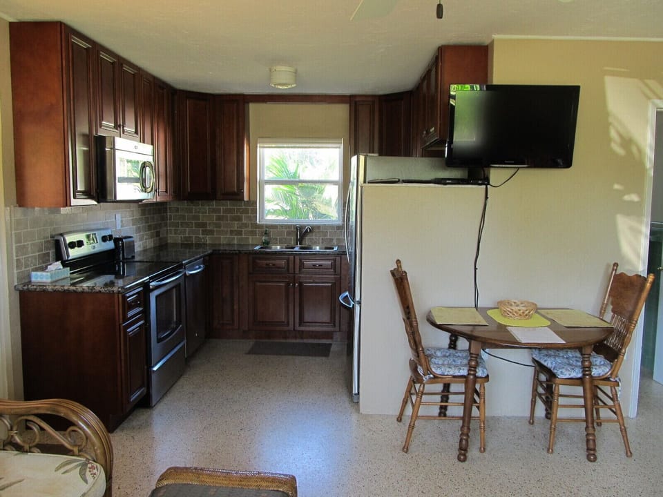 Kitchen, dining area and flat screen television