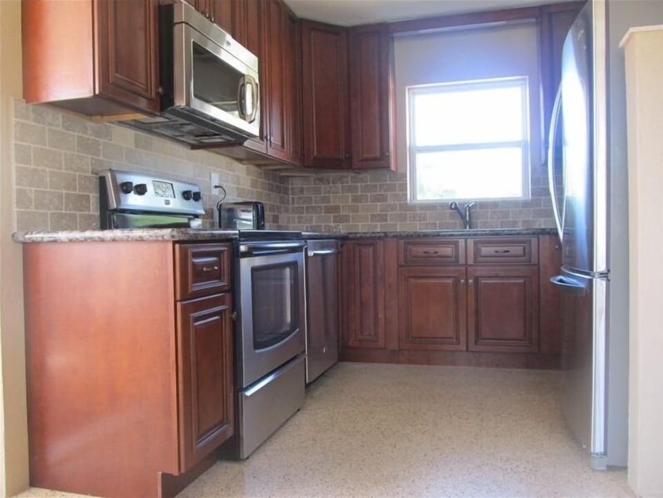 New kitchen with granite and stainless.