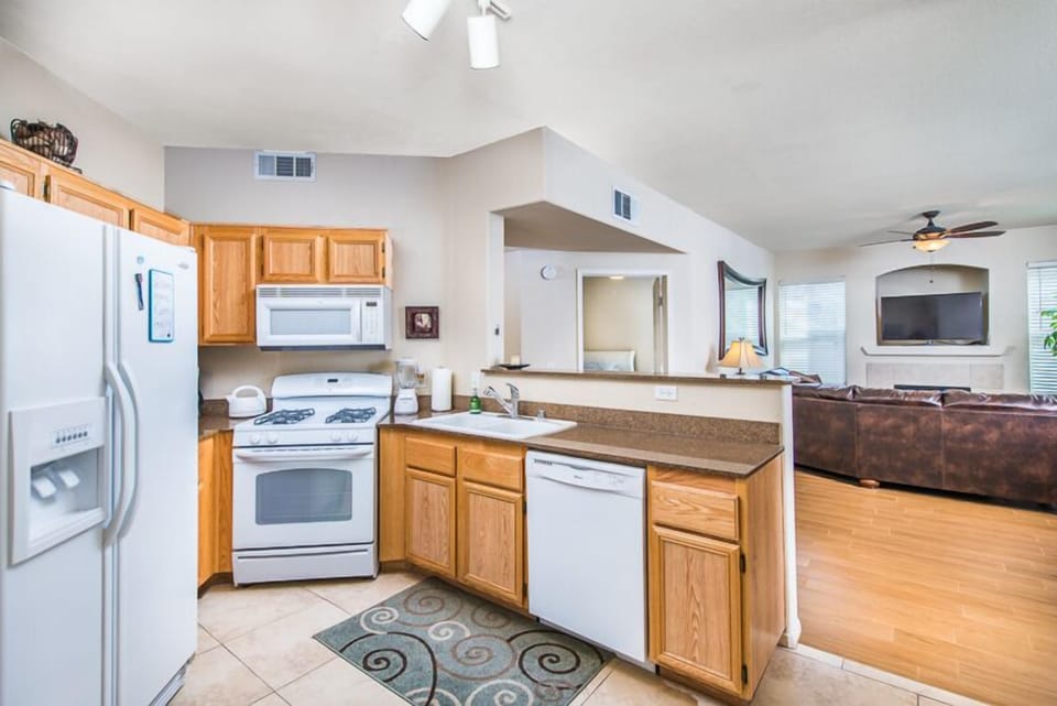 Co-ordinated kitchen with oven, microwave, dishwasher, ice maker, coffee maker