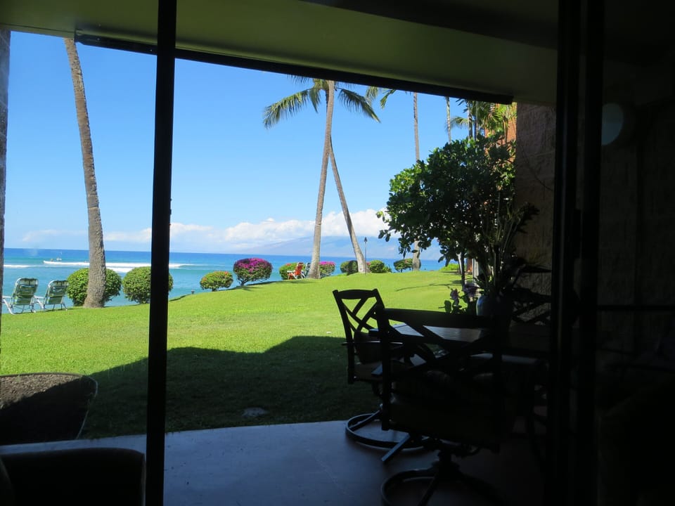 View through the lanai sliding glass doors from the sofa inside our condo.