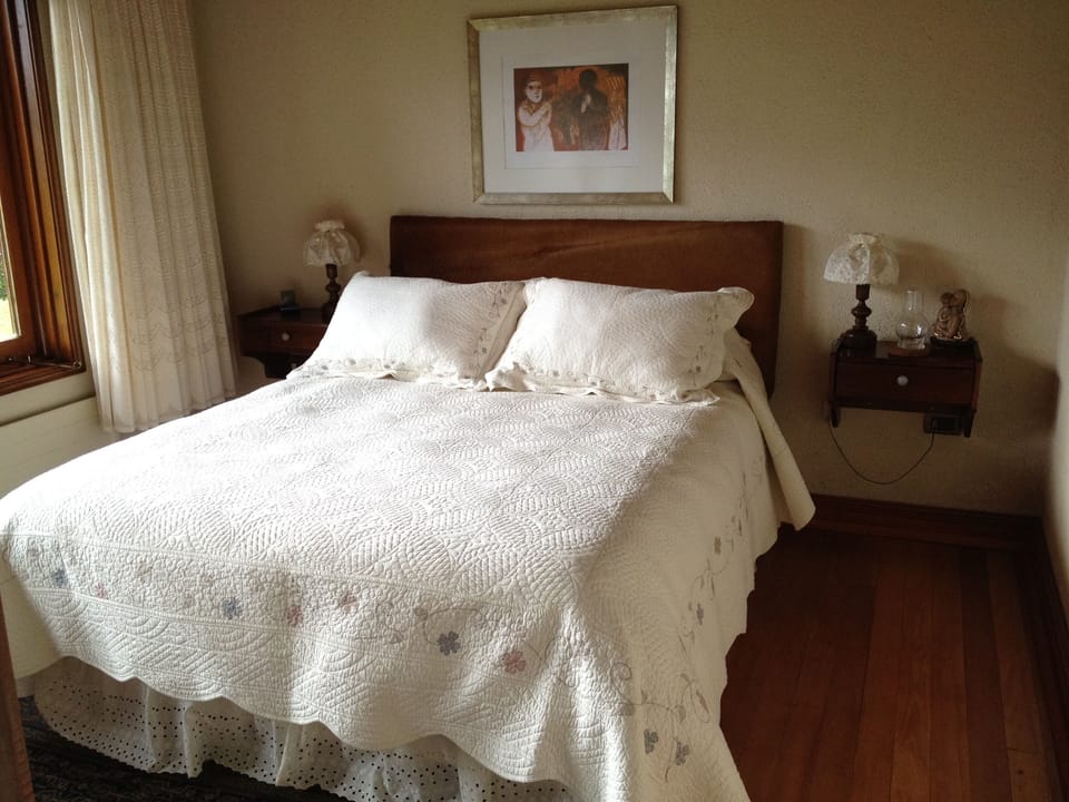 One of four charming bedrooms (each featuring its own en suite bath).
